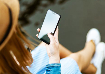 Young female adult looking at her cellphone