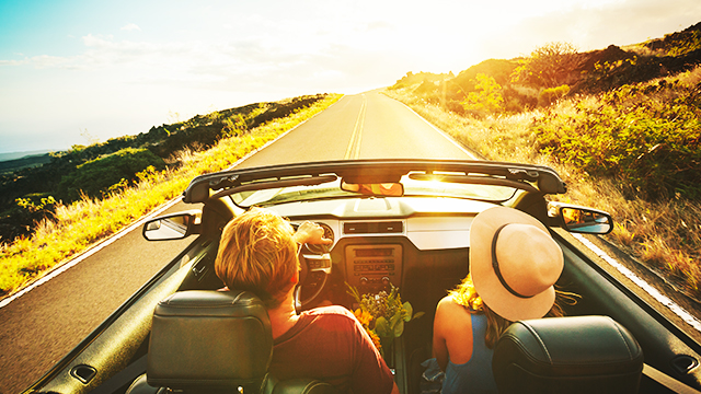 Young couple driving in countryside