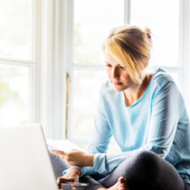 Woman managing her finances from laptop
